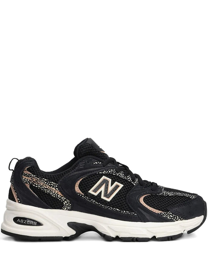 New Balance 530 - Preto/Bege/Dourado