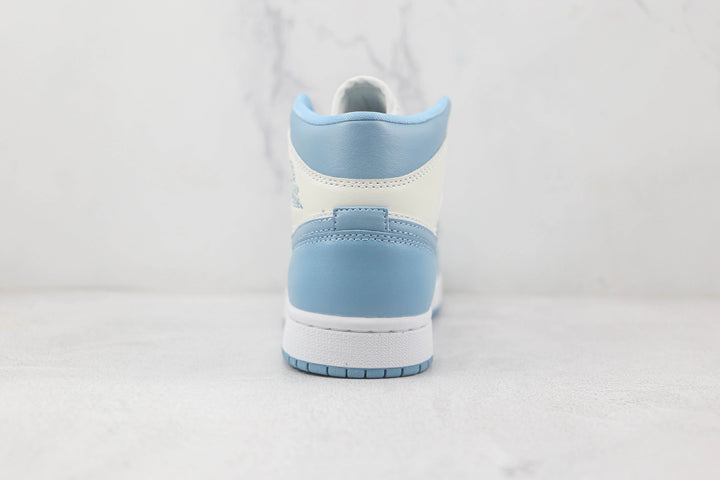 Jordan 1 Mid UNC - Branco/Azul University
